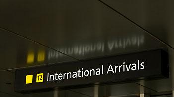 Airport sign for international arrivals © iStockphoto