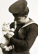 Sailor holding Minnie the cat after escaping a ship sunk by torpedo circa 1940 © RSPCA Photolibrary