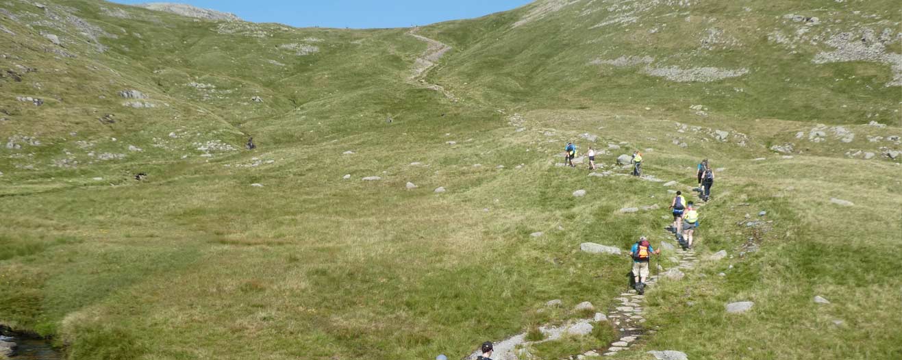 Trekkers walking through the Lake District for charity.