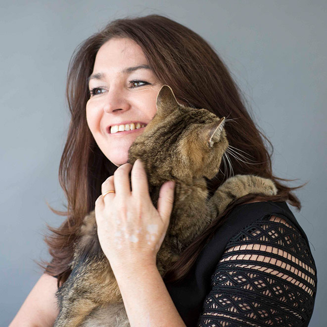 RSPCA CEO Joanna Rowland holding a tabby cat.