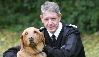Scottish SPCA's Chief Superintendent, Mike Flynn, with a dog