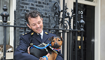 RSPCA Inspector and dog outside 10 Downing street © RSPCA Photolibrary