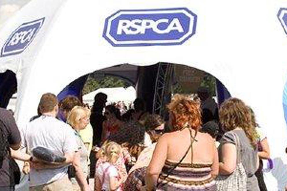 An RSPCA branded tent at a large fundraising event.