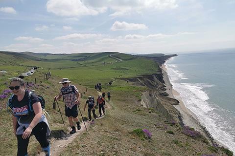 Fundraisers walking along the Isle of Wight coastal path for charity.