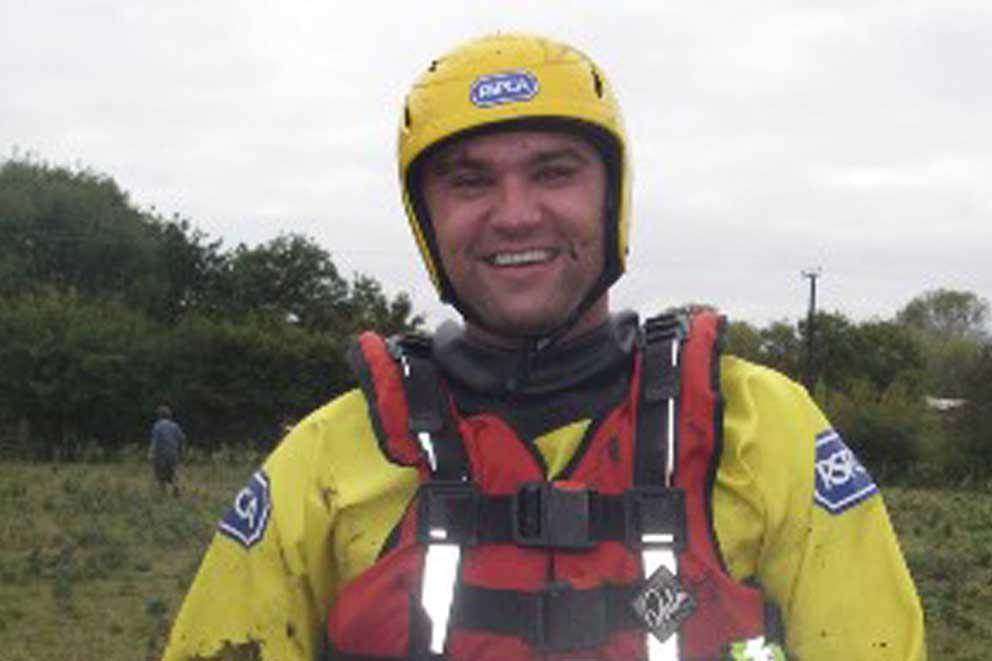 Inspector Jason Finch a member of the RSPCA animal rescue team wearing rescue gear and helmet.