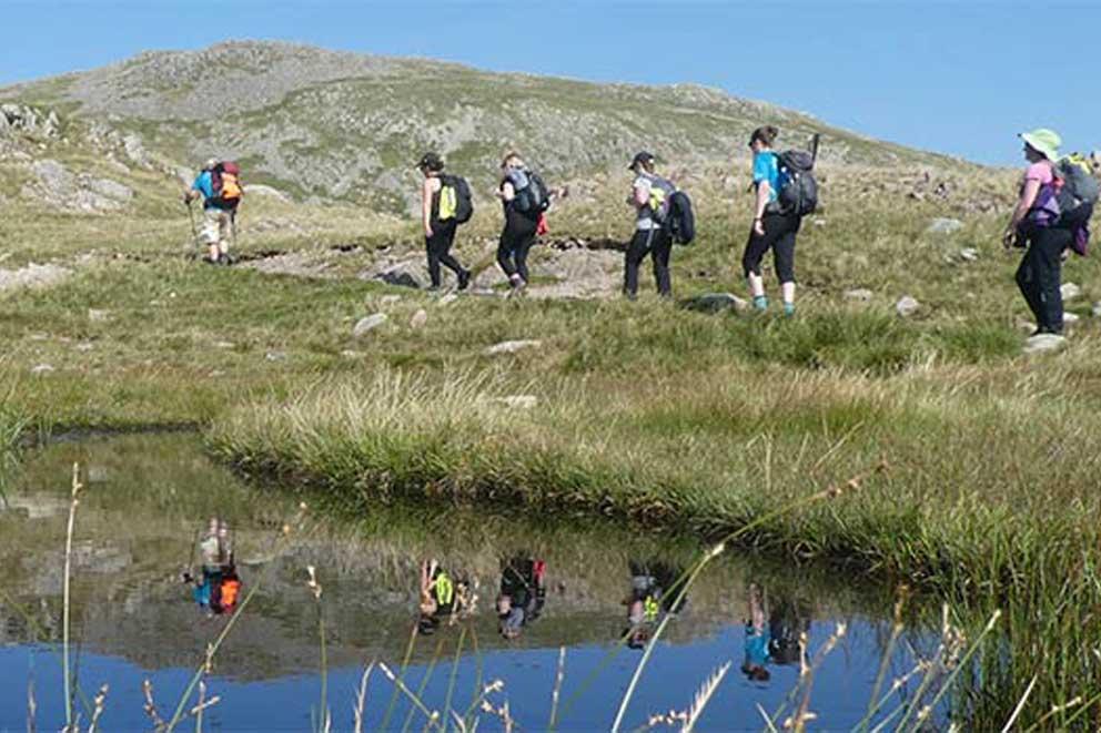 Fundraisers trekking the Lake District Five Peak Challenge for charity.