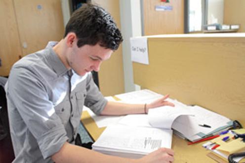 Volunteer Richard Burn doing paperwork