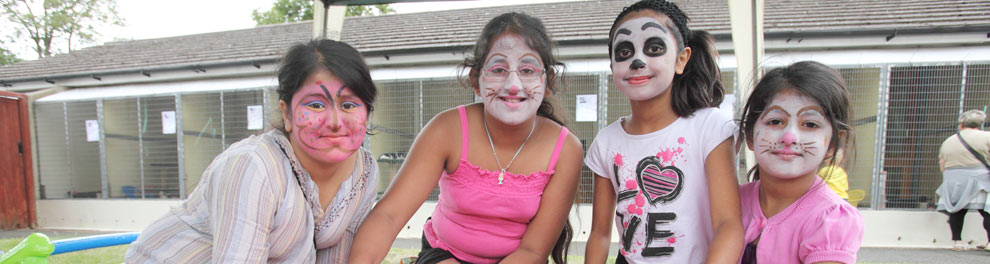 Children with painted faces at a community open day © RSPCA Photolibrary